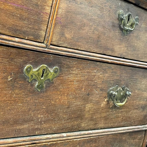 38 - A George III oak chest of drawers. With two short and three long drawers on bracket feet, height 88c... 