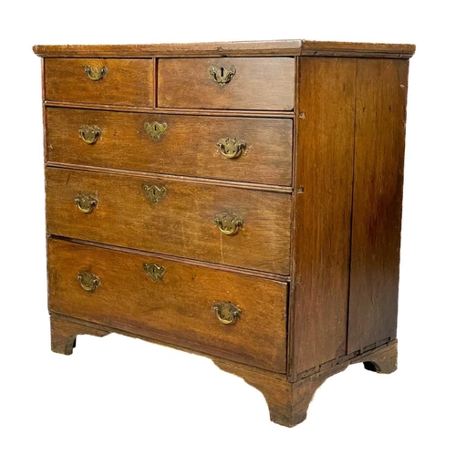 38 - A George III oak chest of drawers. With two short and three long drawers on bracket feet, height 88c... 