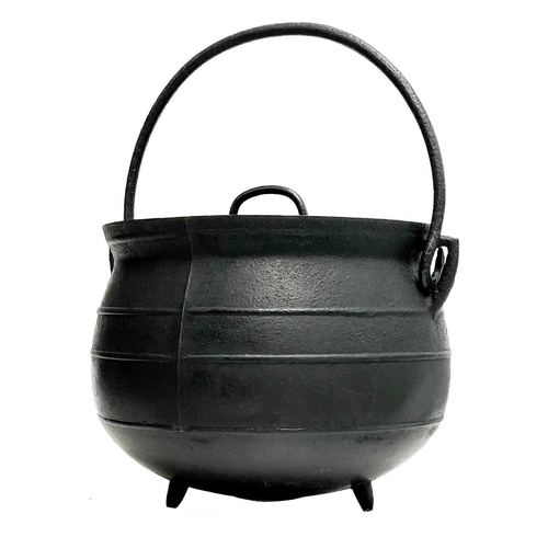 4 - A cast iron cooking cauldron and cover. 19th century, with swing handle, and three peg feet, diamete... 