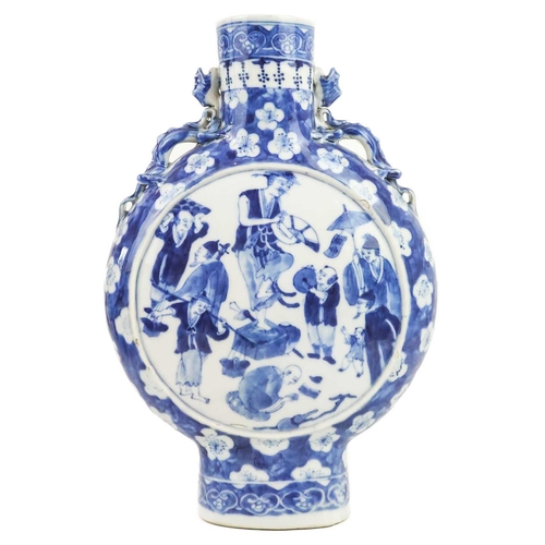 1001 - A Chinese blue and white porcelain moon flask, 19th century. With kylin form handles and prunus patt... 