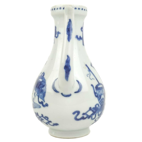 1002 - A Chinese blue and white water jug, Kangxi (1662-1722). Decorated with precious objects and a panel ... 