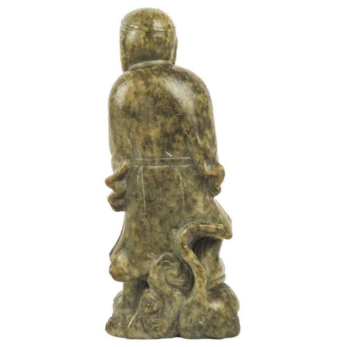 1003 - A Chinese carved soapstone figure, early 20th century. Height 23cm, width 9.5cm, depth 6cm.