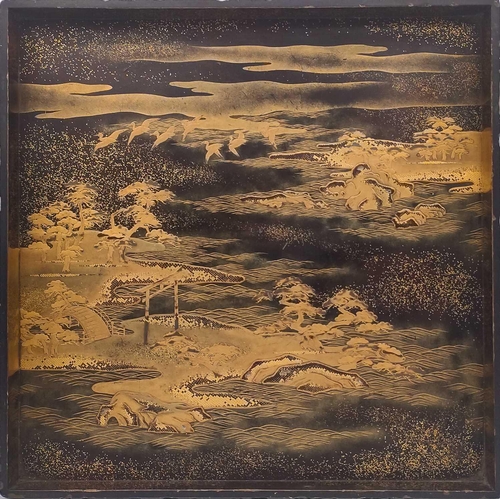 1009 - A Japanese black and gilt lacquered tray, Meiji period. The river landscape with birds, trees, Torii... 