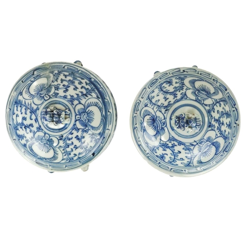 1011 - Two similar Chinese blue and white porcelain pots and covers. Mid 20th century, decorated with flowe... 