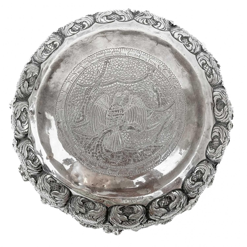 1016 - A Burmese silver bowl, circa 1900. Repousse decorated in high relief with figures and animals, heigh... 