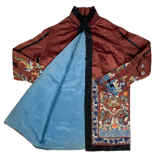 1023 - A Chinese silk embroidered jacket, early 20th century. The dragons with silk and metal thread, lengt... 