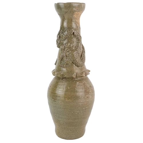 1028 - A Chinese celadon stoneware vase, Song style. The dragon in high relief above a ribbed body, height ... 