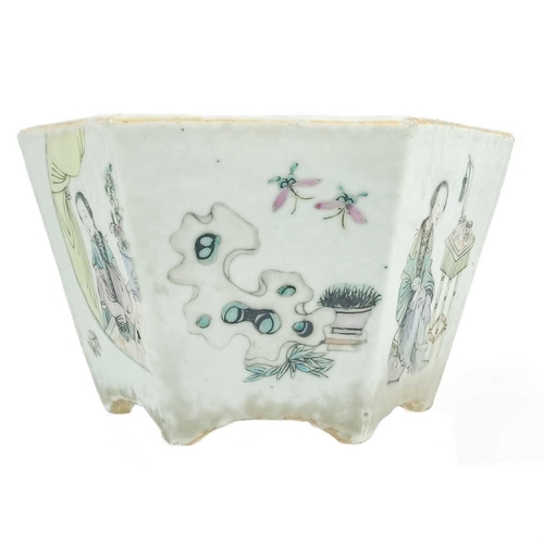 1048 - A Chinese famille rose porcelain jardiniere, circa 1900, With female figures, precious objects and i... 