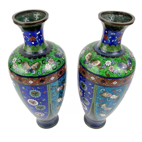 1057 - A pair of Japanese cloisonne vases, Meiji period. Decorated with polychrome panels enclosing butterf... 