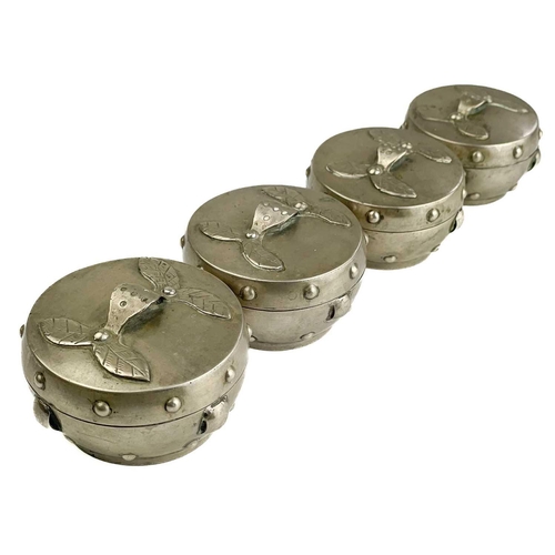 1072 - A Chinese silver set of four graduated circular boxes. The lids with loop strap handles, the boxes w... 