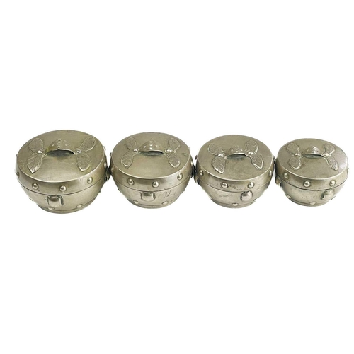 1072 - A Chinese silver set of four graduated circular boxes. The lids with loop strap handles, the boxes w... 