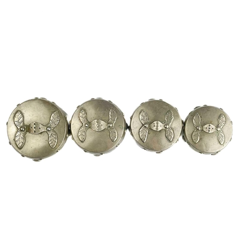 1072 - A Chinese silver set of four graduated circular boxes. The lids with loop strap handles, the boxes w... 