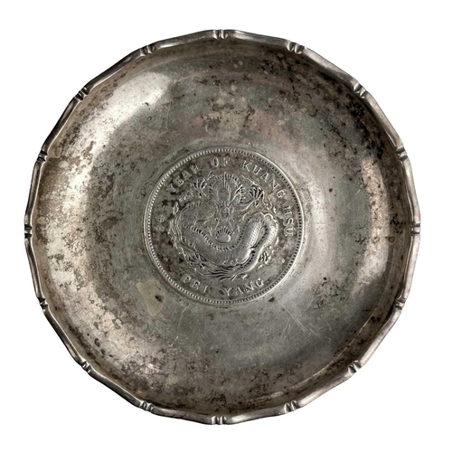 1073 - A Chinese silver dragon dollar Pei Yang coin inset dish, The dish with faux bamboo cast rim, the coi... 