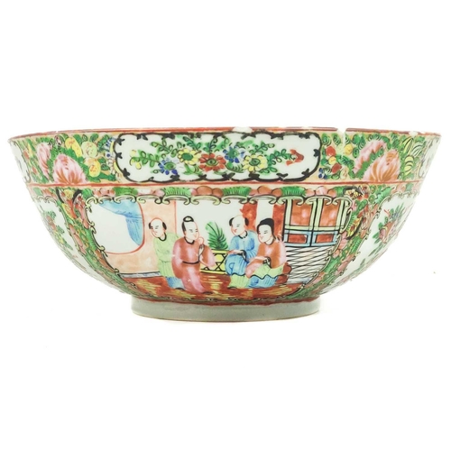 1107 - A Chinese Canton porcelain bowl, 20th century. The alternating panels enclosing figures in an interi... 