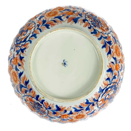 1114 - A Japanese Imari porcelain bowl, 19th century. The interior with a central roundel enclosing a vase ... 