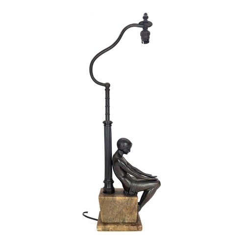 10 - An Art Deco bronze figural table lamp. Modelled as a prone Eve with the apple, stamped F R 696 to th... 