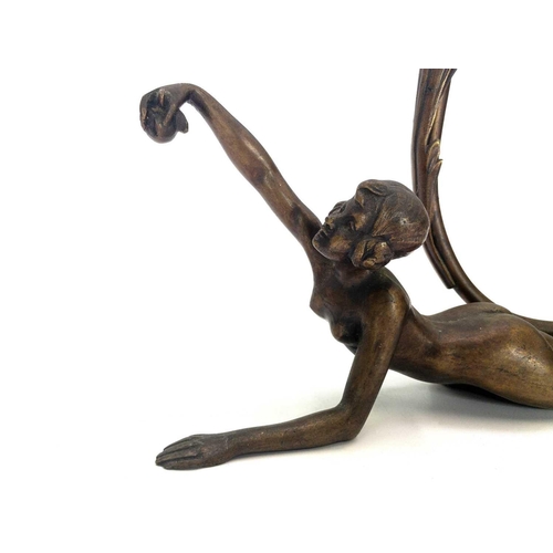 10 - An Art Deco bronze figural table lamp. Modelled as a prone Eve with the apple, stamped F R 696 to th... 