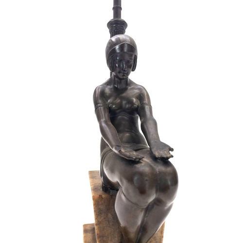 10 - An Art Deco bronze figural table lamp. Modelled as a prone Eve with the apple, stamped F R 696 to th... 