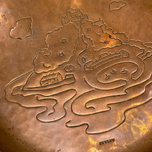 105 - A Newlyn copper small dish. Repousse decorated with a view of St Michael's Mount, stamped mark, diam... 