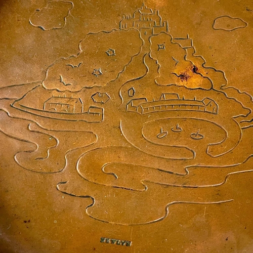 105 - A Newlyn copper small dish. Repousse decorated with a view of St Michael's Mount, stamped mark, diam... 