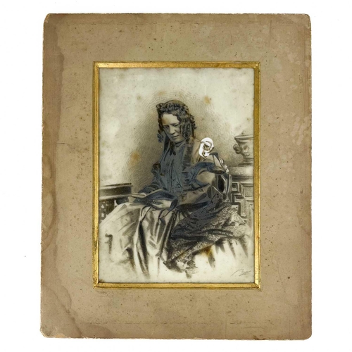 107 - A pair of Victorian opaque glass portrait photographs. Together with a pair of brass candleholders, ... 