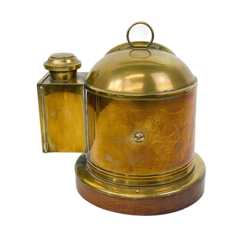 109 - A Sestral brass ship's binnacle compass. Complete with burner, on a mahogany base, height 25cm, diam... 