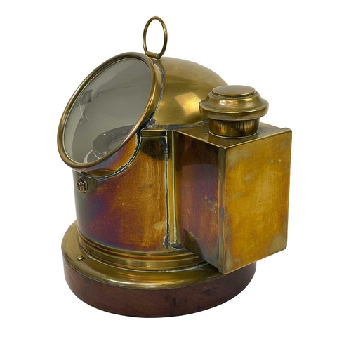 109 - A Sestral brass ship's binnacle compass. Complete with burner, on a mahogany base, height 25cm, diam... 