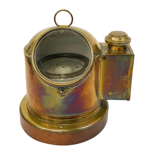 109 - A Sestral brass ship's binnacle compass. Complete with burner, on a mahogany base, height 25cm, diam... 