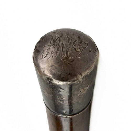 110 - A silver top tropical hardwood walking cane. Indistinct hallmarks, together with an ebonised walking... 