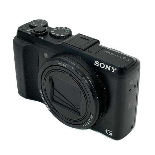 112 - A Sony Cybershot DSC-HX50 digital camera. Together with a leather case, two batteries and a power le... 