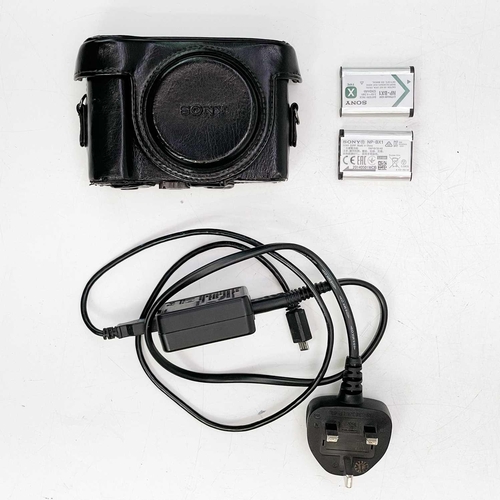 112 - A Sony Cybershot DSC-HX50 digital camera. Together with a leather case, two batteries and a power le... 