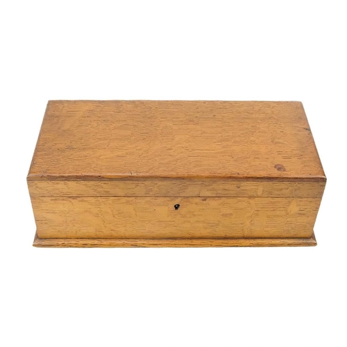 128 - An early 20th century souvenir oak box. The interior of the lid inscribed and decorated The War Fran... 