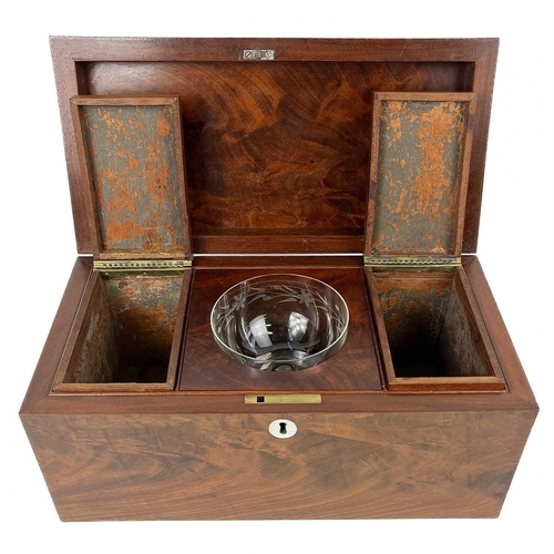 131 - A 19th century flame mahogany tea caddy. The interior in three sections with two lidded removable co... 