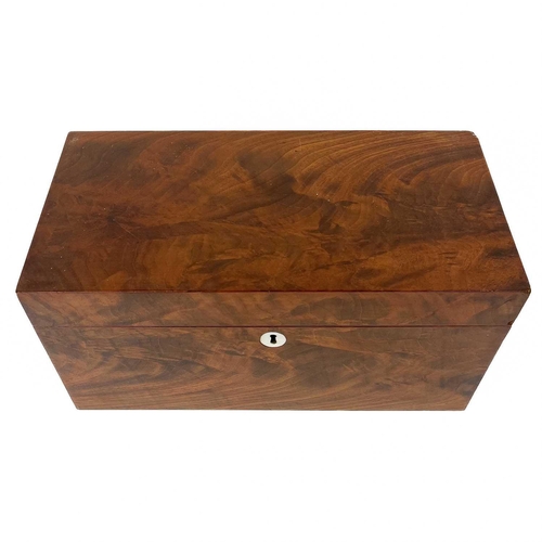 131 - A 19th century flame mahogany tea caddy. The interior in three sections with two lidded removable co... 