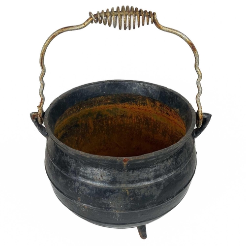 137 - A circular cast iron cauldron. Diameter 28cm together with other cast iron cauldrons and trivets.