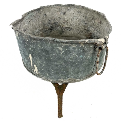 137 - A circular cast iron cauldron. Diameter 28cm together with other cast iron cauldrons and trivets.