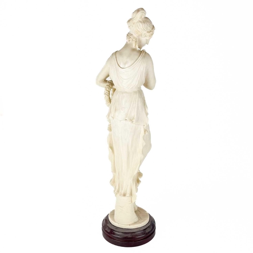 146 - A composite figure of a neo-classical maiden. On wooden base, height 67cm.