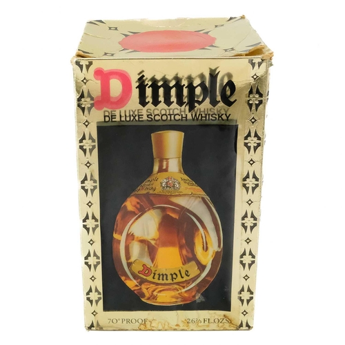 16 - A bottle of Dimple De Luxe Scotch Whisky. 70% Proof 26 2/3 Fl.Ozs in the original box.