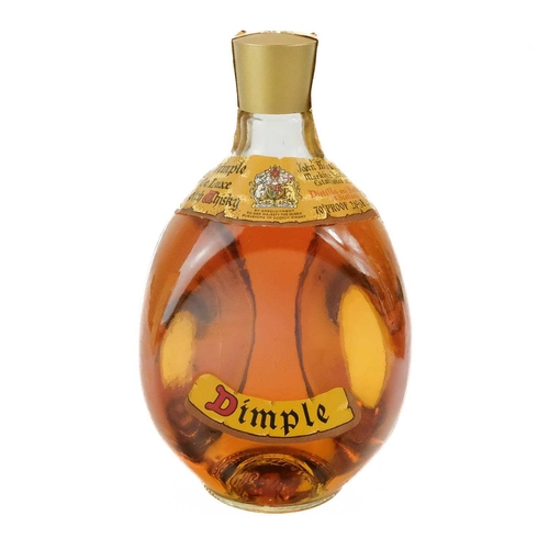 16 - A bottle of Dimple De Luxe Scotch Whisky. 70% Proof 26 2/3 Fl.Ozs in the original box.