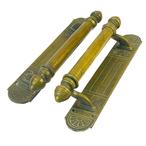 168 - A pair of late Victorian brass door handles. Height 30cm.