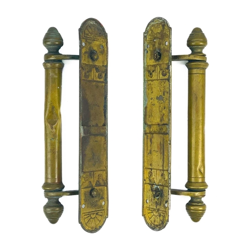 168 - A pair of late Victorian brass door handles. Height 30cm.