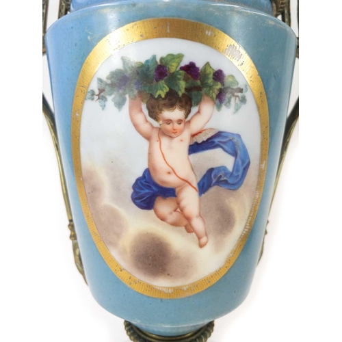 170 - A Paris porcelain lamp base. Circa 1880, painted with a cherub and flowers, with gilt metal mounts, ... 