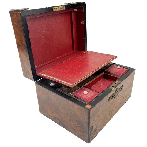 177 - A Victorian rosewood and brass bound travelling toilet box. The hinged lift top encloses a lift out ... 