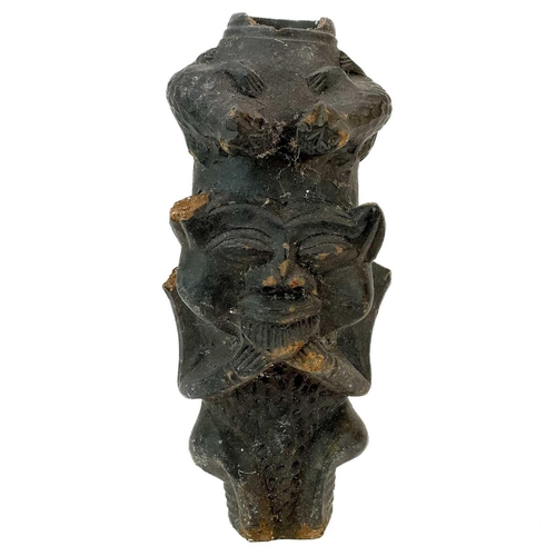 179 - An African clay pipe. Moulded with three heads, length 54cm, together with three other similar pipes... 