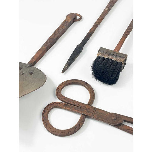 180 - An Archibald Carne, Truro wrought iron companion set. Mid 20th century, comprising tongs, shovel, po... 