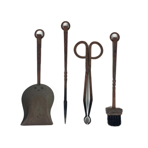 180 - An Archibald Carne, Truro wrought iron companion set. Mid 20th century, comprising tongs, shovel, po... 