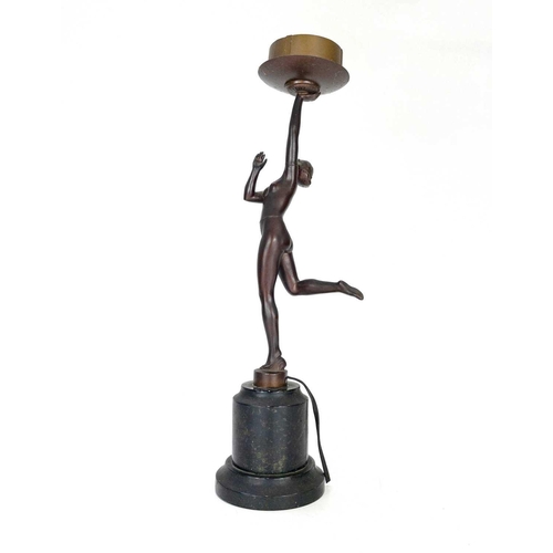 181 - An Art Deco gilt spelter figural table lamp. Modelled as a kneeling female dancer on a stepped diamo... 