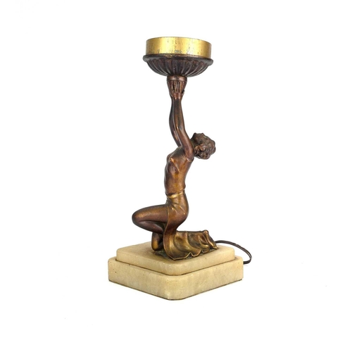 181 - An Art Deco gilt spelter figural table lamp. Modelled as a kneeling female dancer on a stepped diamo... 