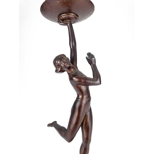 181 - An Art Deco gilt spelter figural table lamp. Modelled as a kneeling female dancer on a stepped diamo... 