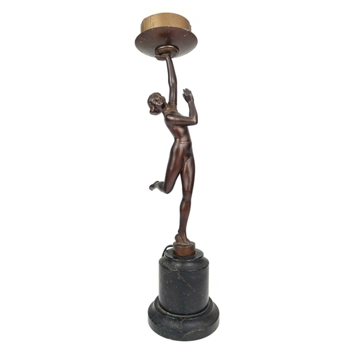 181 - An Art Deco gilt spelter figural table lamp. Modelled as a kneeling female dancer on a stepped diamo... 